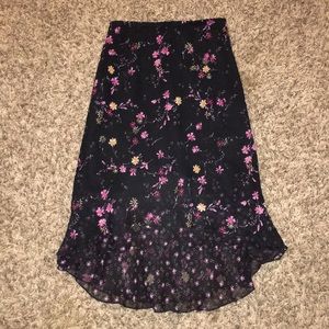Black skirt with flower design.